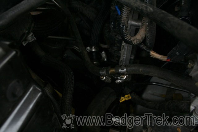 Heated coolant return to water-pump (braid covered hose) and Filter return (brass T)